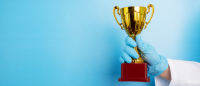 Nurse holding award